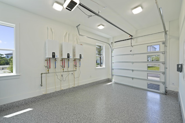 80 Sea Croft Dr, Santa Rosa Beach, FL 32459 - garage featuring baseboards, a garage door opener, and water heater