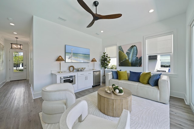 80 Sea Croft Dr, Santa Rosa Beach, FL 32459 - living room featuring light wood finished floors, ceiling fan with notable chandelier, recessed lighting, baseboards, and visible vents