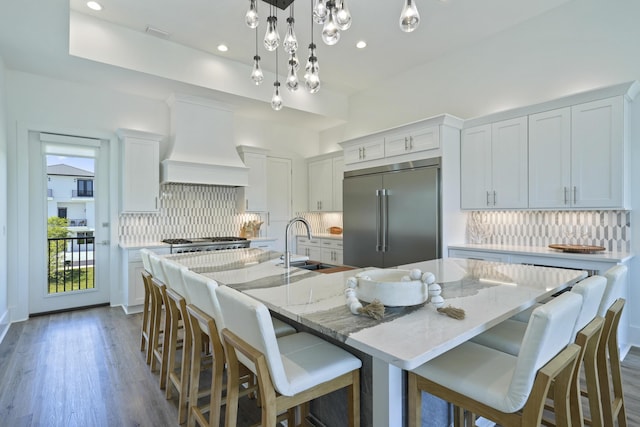 80 Sea Croft Dr, Santa Rosa Beach, FL 32459 - kitchen with a sink, appliances with stainless steel finishes, premium range hood, and decorative backsplash