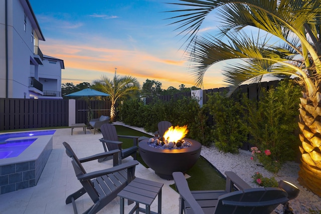 80 Sea Croft Dr, Santa Rosa Beach, FL 32459 - view of patio with an in ground hot tub, fence, and a fire pit