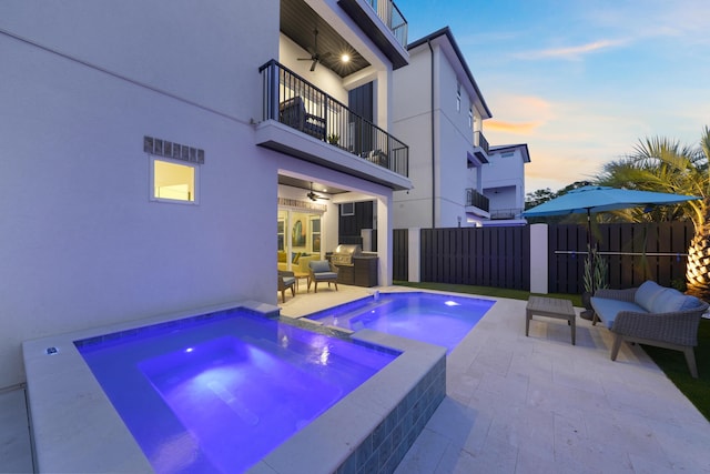 80 Sea Croft Dr, Santa Rosa Beach, FL 32459 - pool at dusk with fence, an outdoor hangout area, an in ground hot tub, a ceiling fan, and a patio