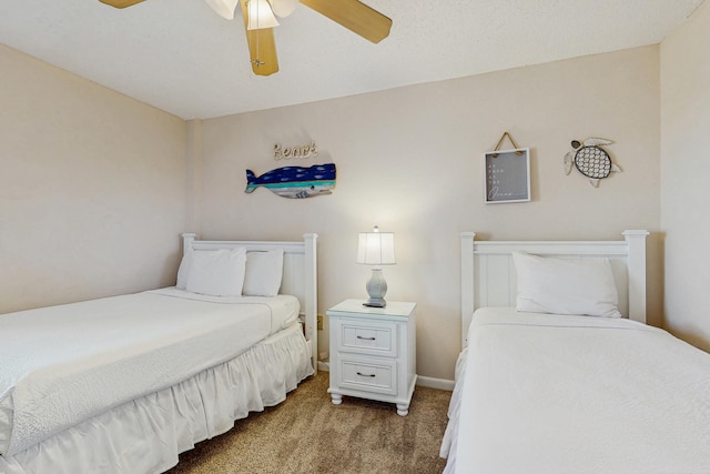 carpeted bedroom with baseboards and a ceiling fan