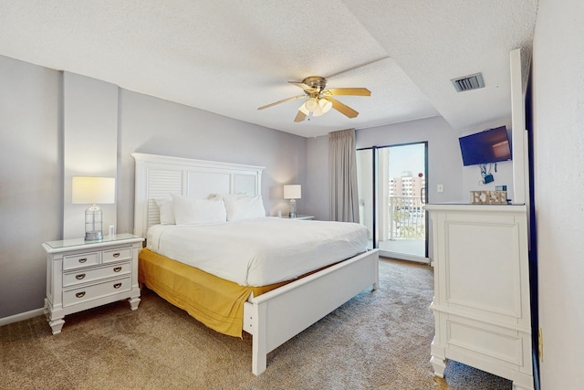 carpeted bedroom featuring baseboards, a textured ceiling, visible vents, access to exterior, and ceiling fan