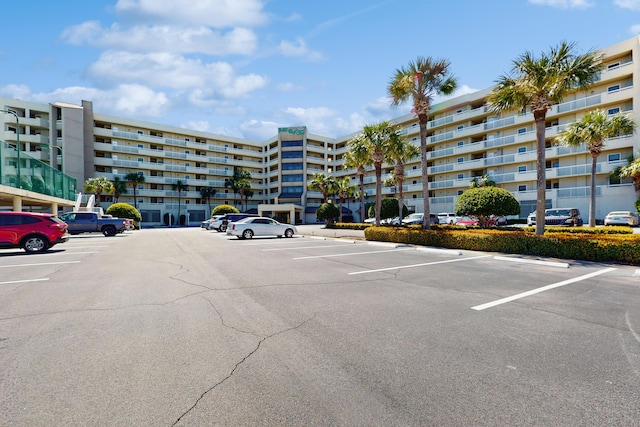 view of property featuring uncovered parking