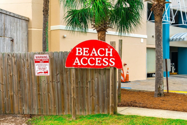 community sign with fence