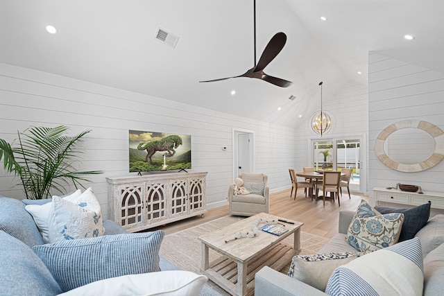 34 Debbie Ln, Santa Rosa Beach, FL 32459 - living room featuring a chandelier, ceiling fan, recessed lighting, light wood-style flooring, and wooden walls