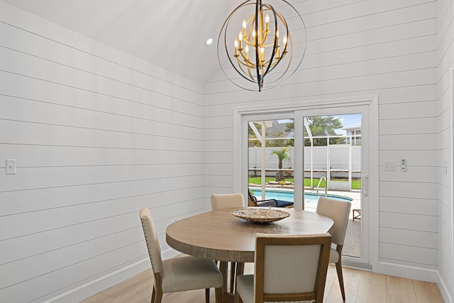 34 Debbie Ln, Santa Rosa Beach, FL 32459 - dining space featuring a chandelier, light wood-style flooring, and lofted ceiling