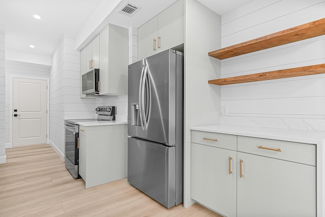 34 Debbie Ln, Santa Rosa Beach, FL 32459 - kitchen with appliances with stainless steel finishes, open shelves, light wood-style flooring, recessed lighting, and tasteful backsplash