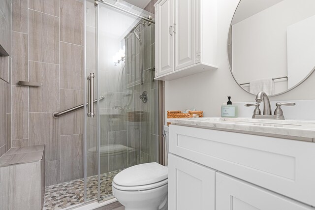 34 Debbie Ln, Santa Rosa Beach, FL 32459 - bathroom featuring vanity, toilet, and a stall shower