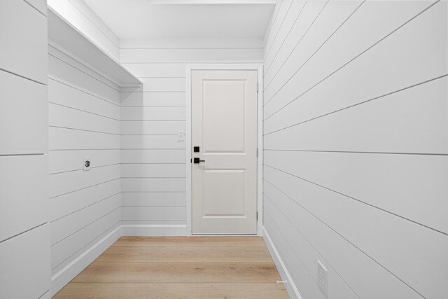 34 Debbie Ln, Santa Rosa Beach, FL 32459 - hallway featuring light wood-style flooring and wood walls