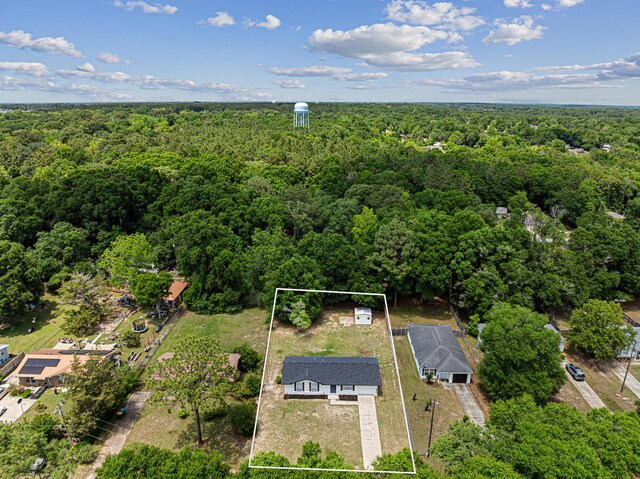 2899 Wisteria Ave, Crestview, FL 32539 - aerial view of property and surrounding area with a heavily wooded area and property boundaries highlighted