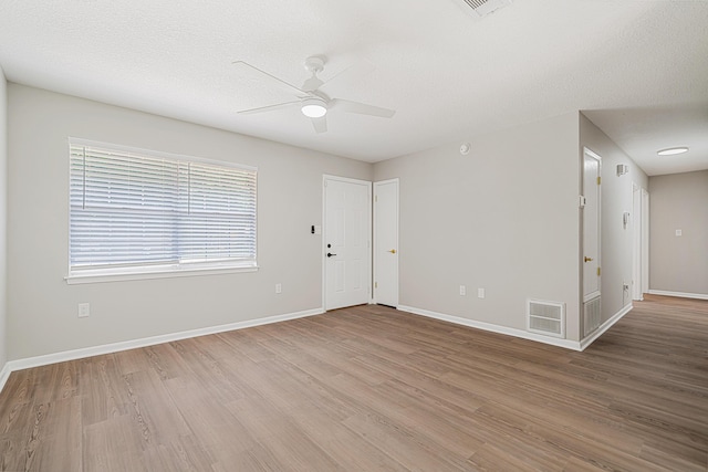 2899 Wisteria Ave, Crestview, FL 32539 - empty room featuring ceiling fan, light wood-style floors, and baseboards