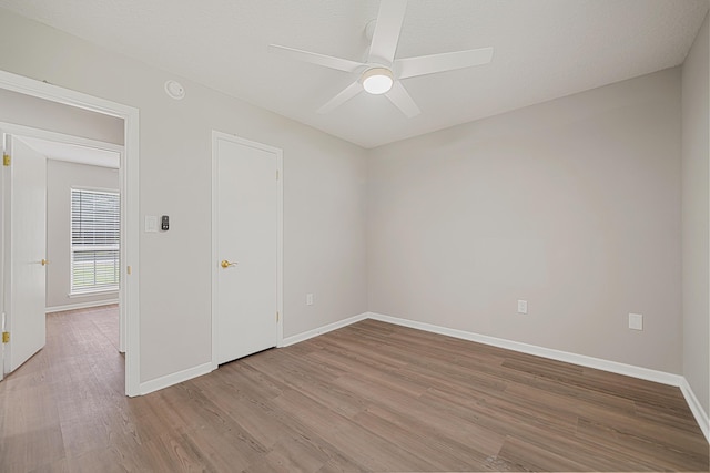 2899 Wisteria Ave, Crestview, FL 32539 - spare room featuring wood finished floors, baseboards, and a ceiling fan
