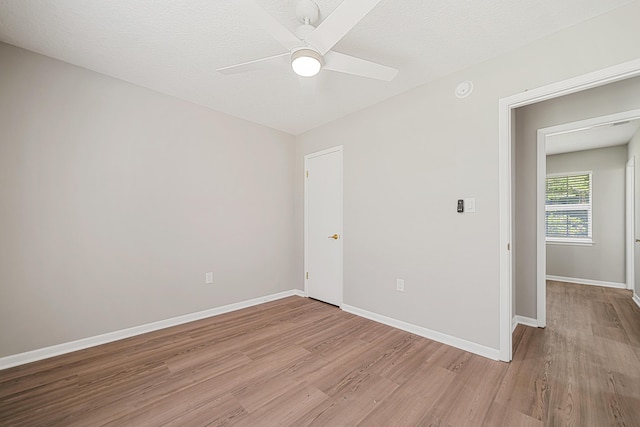 2899 Wisteria Ave, Crestview, FL 32539 - spare room with light wood-style floors, ceiling fan, and baseboards