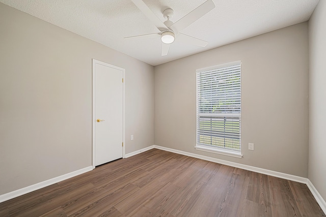2899 Wisteria Ave, Crestview, FL 32539 - empty room with wood finished floors, baseboards, and ceiling fan