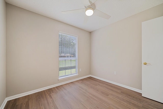 2899 Wisteria Ave, Crestview, FL 32539 - empty room with wood finished floors, baseboards, and ceiling fan