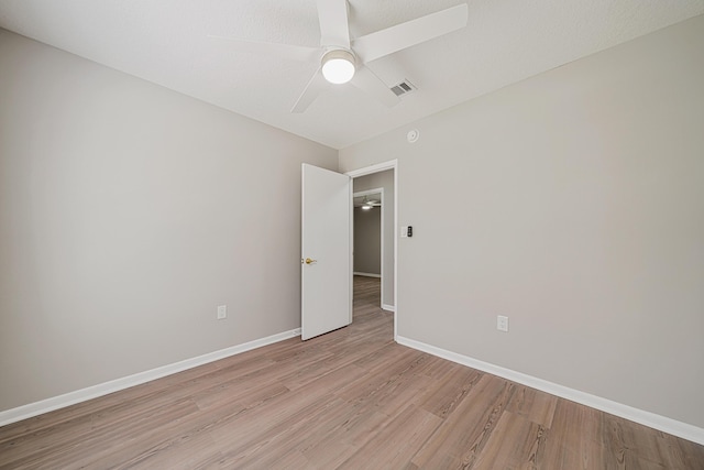 2899 Wisteria Ave, Crestview, FL 32539 - spare room with light wood-type flooring, ceiling fan, and baseboards