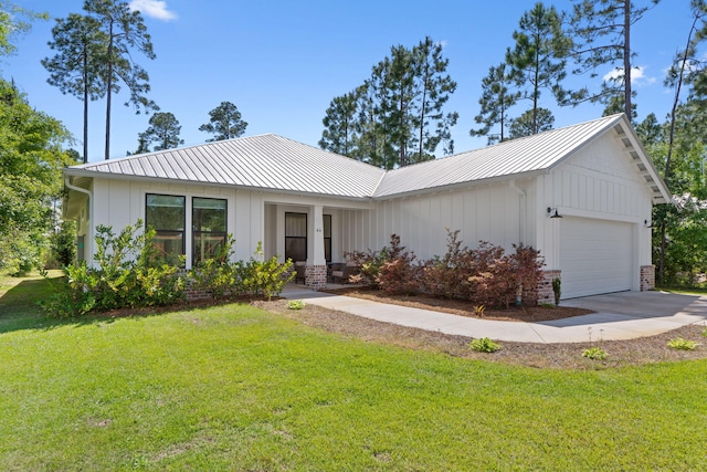 ranch-style home with a garage, board and batten siding, a front yard, and concrete driveway