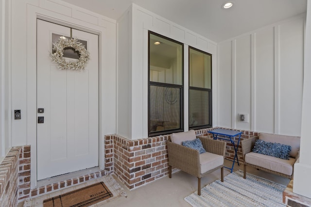view of exterior entry featuring board and batten siding