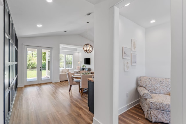 sitting room featuring recessed lighting, wood finished floors, an inviting chandelier, visible vents, and lofted ceiling