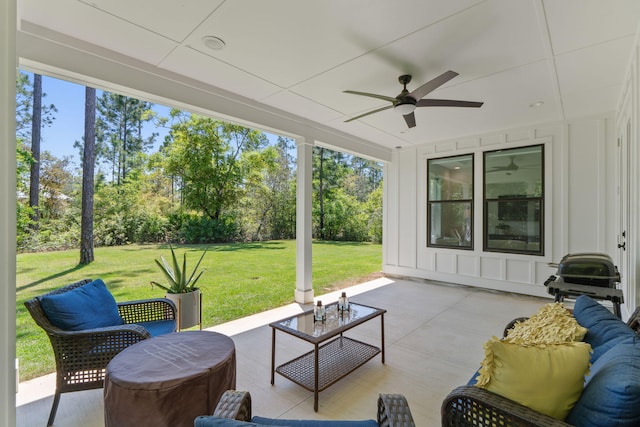 view of patio featuring outdoor lounge area, grilling area, and a ceiling fan