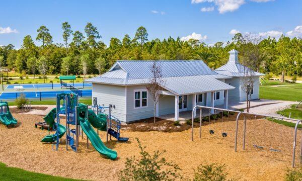exterior space featuring metal roof, a playground, and a chimney