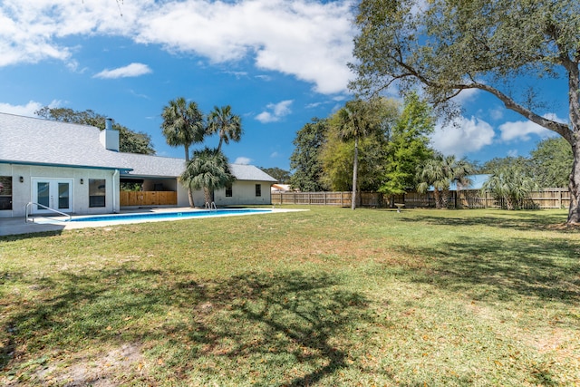 809 Main St, Destin, FL 32541 - view of yard with a fenced in pool, a patio, french doors, and a fenced backyard