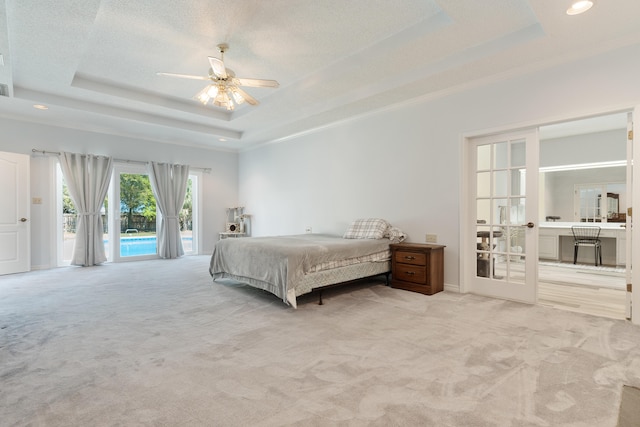 809 Main St, Destin, FL 32541 - bedroom with a tray ceiling, access to outside, light colored carpet, and recessed lighting