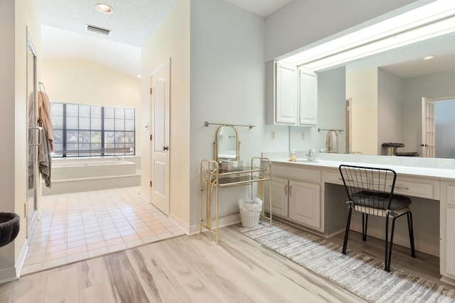 809 Main St, Destin, FL 32541 - full bath with vanity, recessed lighting, visible vents, a bath, and wood finished floors