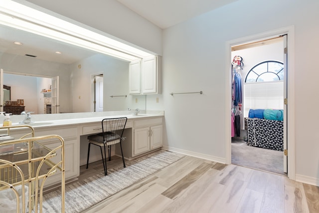 809 Main St, Destin, FL 32541 - bathroom featuring wood finished floors, vanity, baseboards, and visible vents