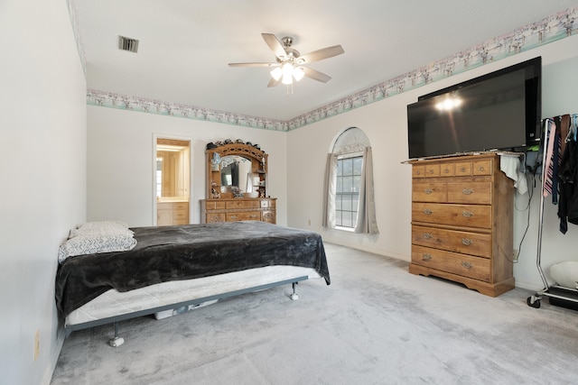 809 Main St, Destin, FL 32541 - carpeted bedroom with visible vents, baseboards, connected bathroom, and ceiling fan