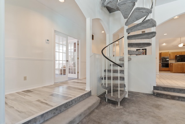 809 Main St, Destin, FL 32541 - stairway with baseboards, recessed lighting, arched walkways, and carpet