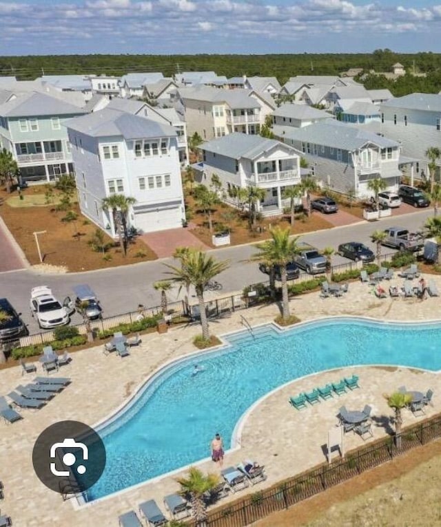 pool featuring a residential view and fence