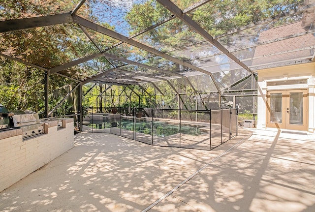 237 Matties Way, Destin, FL 32541 - view of patio / terrace featuring french doors, exterior kitchen, a lanai, area for grilling, and a pool with connected hot tub