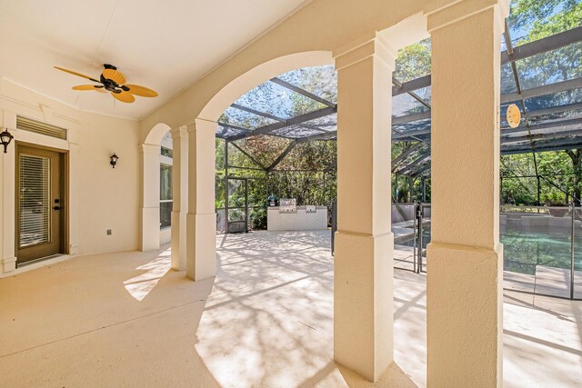 237 Matties Way, Destin, FL 32541 - view of patio with ceiling fan, glass enclosure, and an outdoor kitchen
