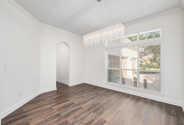 237 Matties Way, Destin, FL 32541 - spare room with a chandelier, ornamental molding, arched walkways, dark wood-style floors, and baseboards