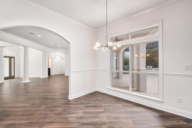 237 Matties Way, Destin, FL 32541 - unfurnished dining area featuring arched walkways, ornamental molding, baseboards, wood finished floors, and a chandelier
