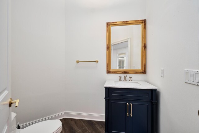 237 Matties Way, Destin, FL 32541 - bathroom with wood finished floors, toilet, baseboards, and vanity