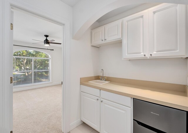 237 Matties Way, Destin, FL 32541 - kitchen featuring ceiling fan, a sink, white cabinetry, and light colored carpet