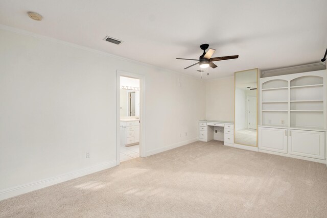 237 Matties Way, Destin, FL 32541 - unfurnished bedroom with light carpet, ornamental molding, baseboards, ensuite bath, and a ceiling fan