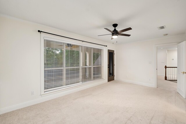 237 Matties Way, Destin, FL 32541 - spare room with light colored carpet, ornamental molding, ceiling fan, and baseboards