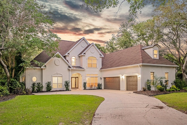 237 Matties Way, Destin, FL 32541 - view of front of house featuring stucco siding, a garage, a yard, and a shingled roof