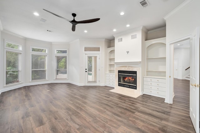 237 Matties Way, Destin, FL 32541 - unfurnished living room featuring ceiling fan, crown molding, a tiled fireplace, recessed lighting, and baseboards