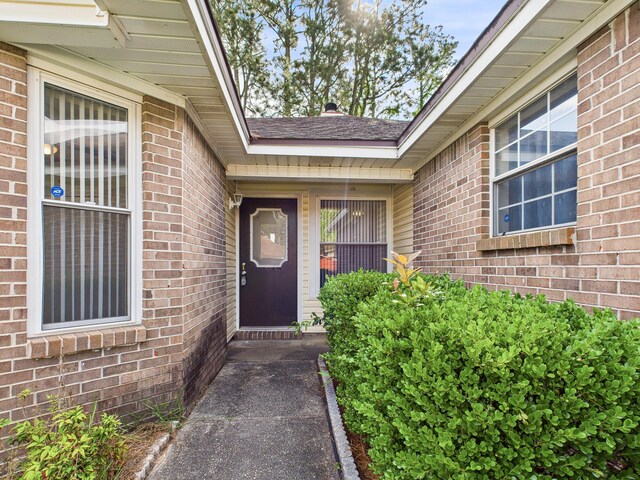 entrance to property with brick siding