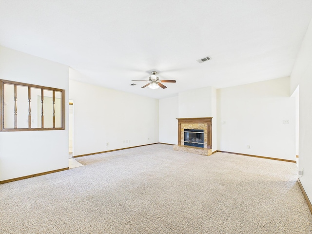 unfurnished living room with light carpet, baseboards, a ceiling fan, and visible vents