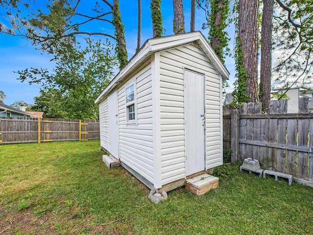 view of shed featuring a fenced backyard