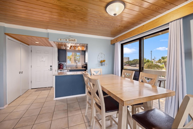 dining space featuring light tile patterned floors and wood ceiling