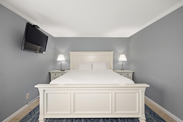 bedroom featuring baseboards and ornamental molding
