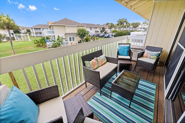 balcony with a residential view and an outdoor hangout area
