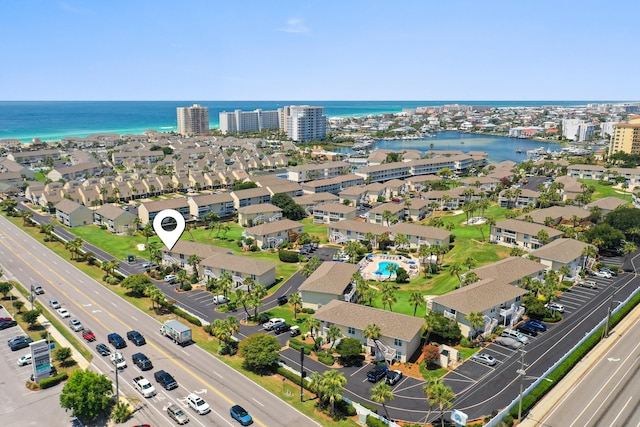 drone / aerial view featuring a water view and a city view